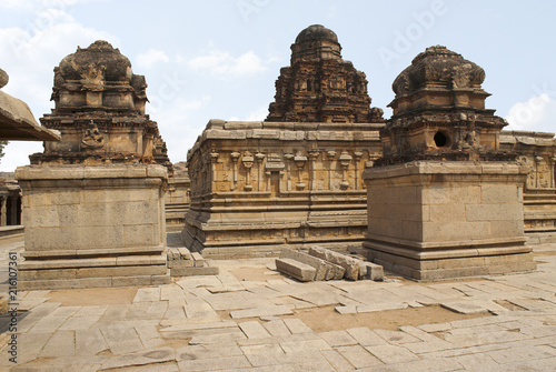 The Subrahmanya shrine on the left, the main sanctum in the centre and another shrine on the left side, Krishna Temple, Hampi, Karnataka. Sacred Center. View from the south.