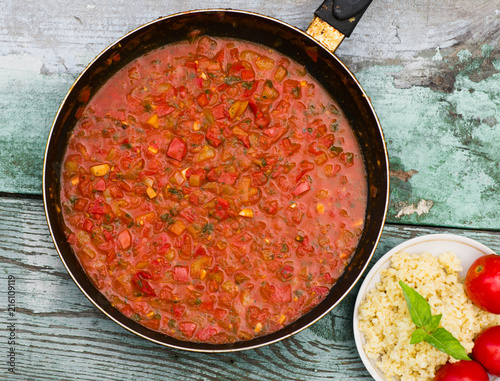 large pan of Italian sauce with tomatoes