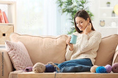 Young woman drinking coffee...