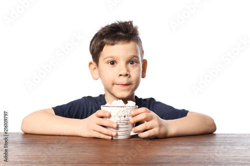 Cute little boy with cup of...