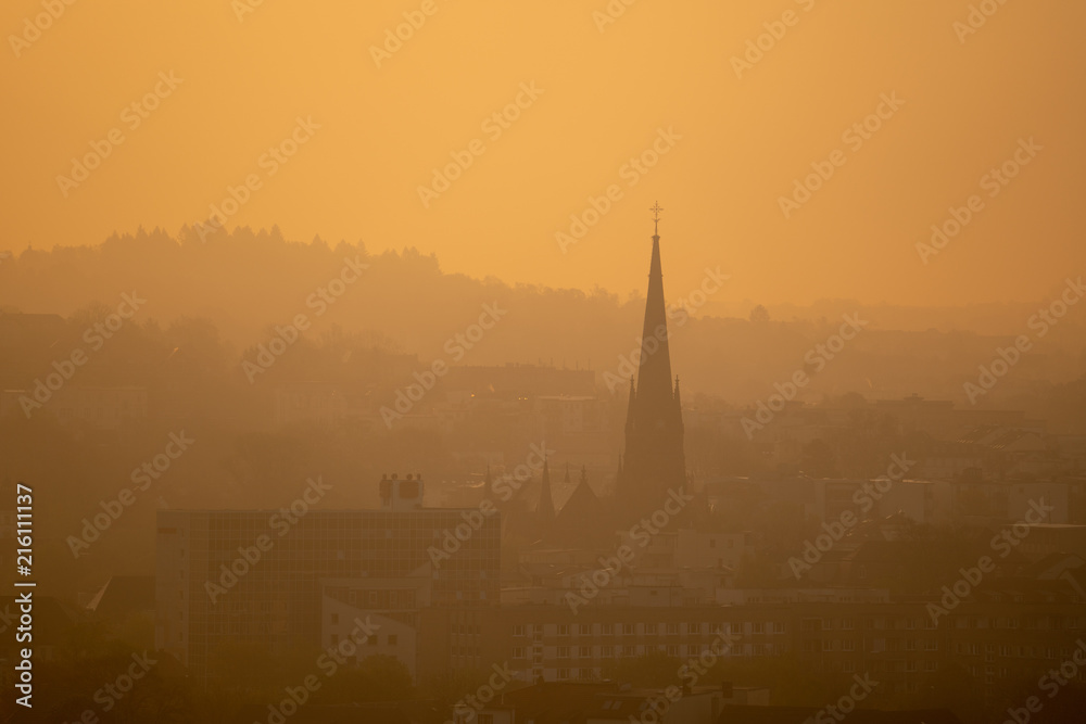 silhouette of the village church in the early morning