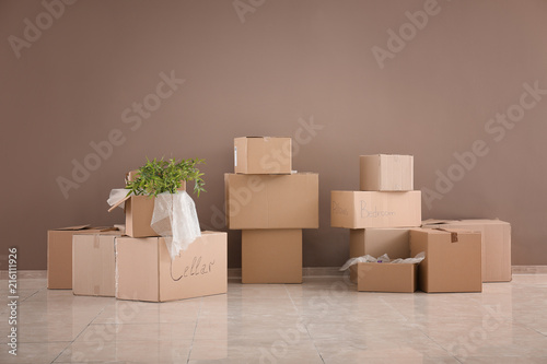 Packed carton boxes on floo...