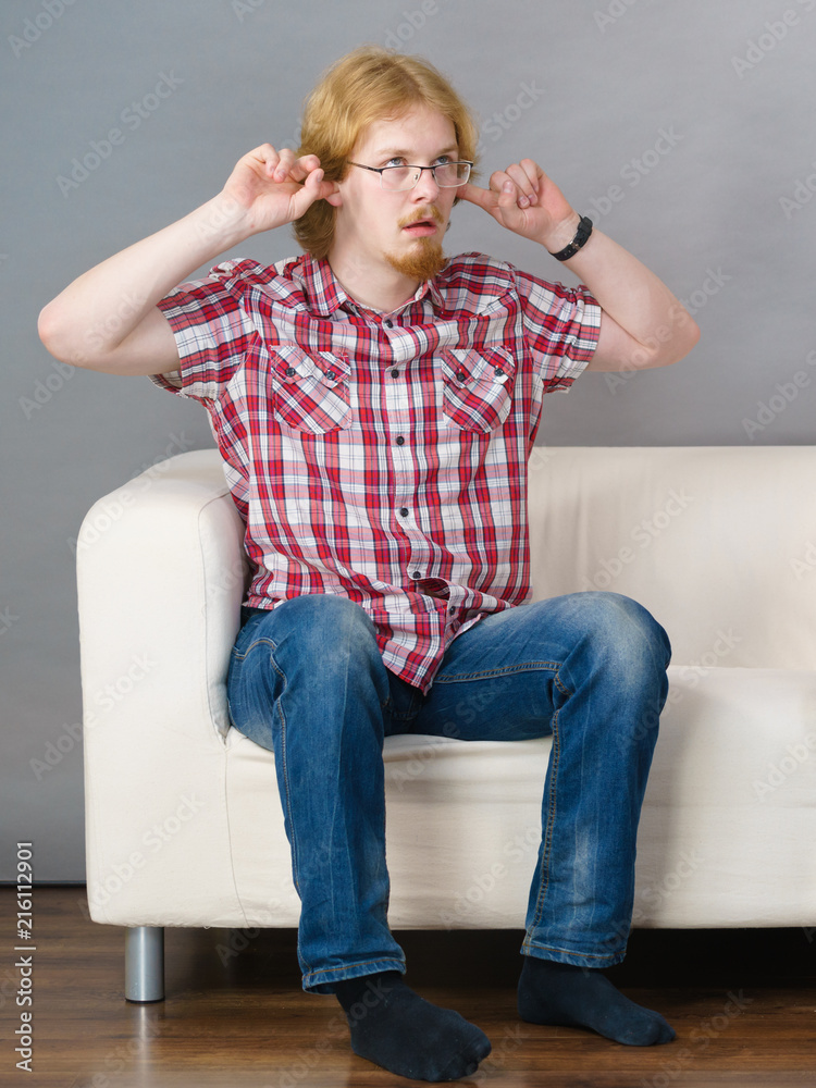 Fototapeta premium Man being annoyed with noise