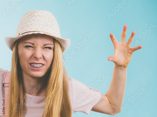 Funny angry teenage woman photo