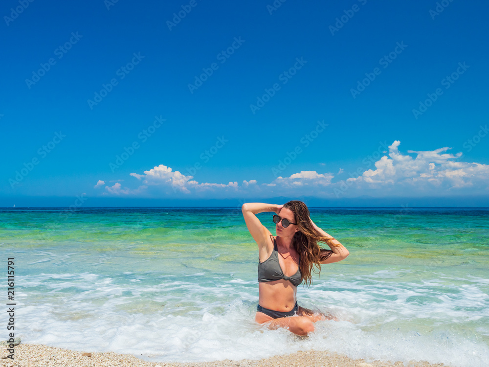 woman sunbathing on the beach