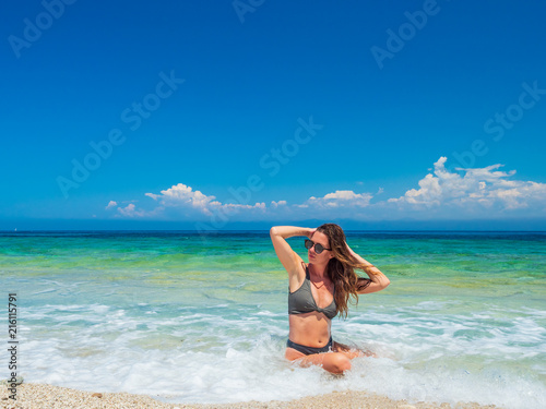 woman sunbathing on the beach © Netfalls
