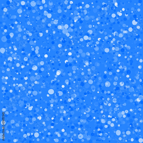 Blue christmas background, winter snowfall pattern. Falling white snowflakes on bright backdrop for season greeting card.