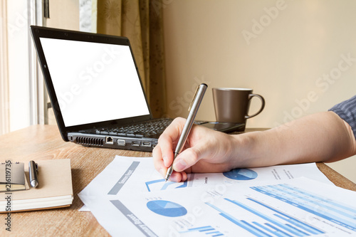 business man analyzing graph and chart document