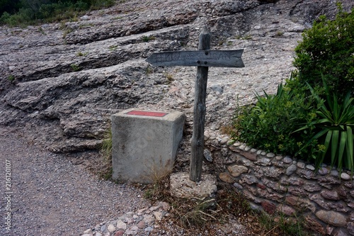 The signpost of the road to the top of the Montserrat mountain in the Pyrenees.