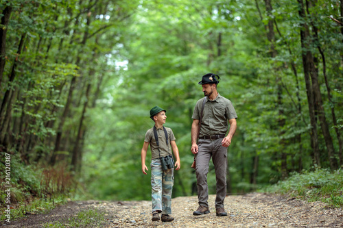 Ranger and his son in the woods