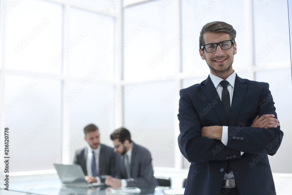 smiling businessman on the background of the Bank office