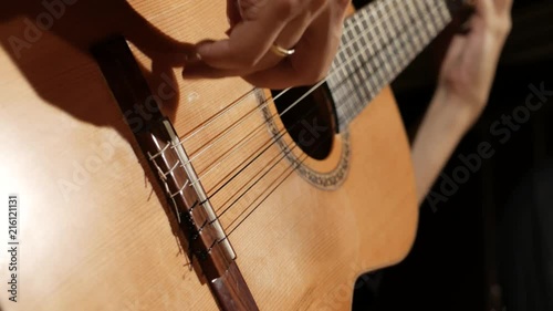 Right hand on guitar