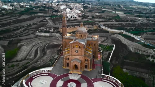 Circular drone shot of Ta' Pinu Church landmark in Gozo photo