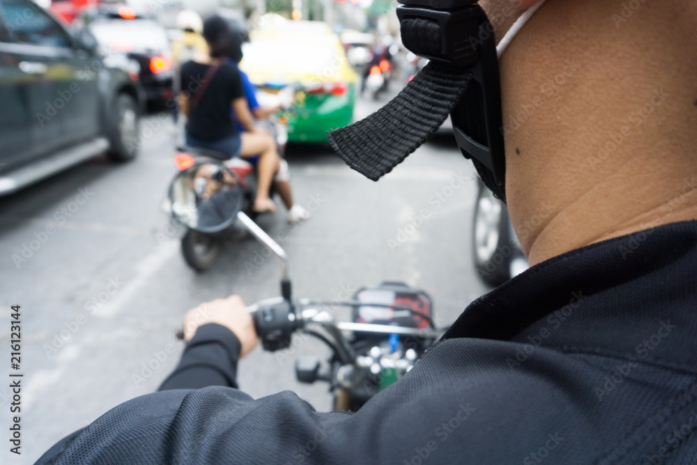 Obraz premium Man hands of motorcycle on a street.