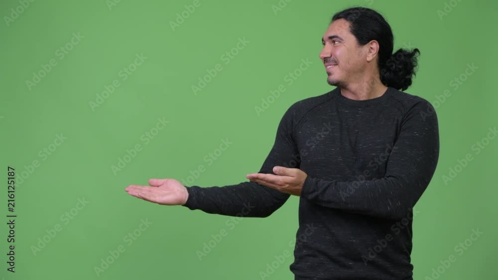 Handsome man showing something Handsome man showing something