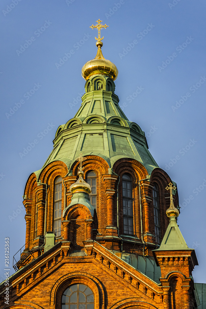 Fototapeta premium Uspenski cathedral (Uspenskin katedraali, 1862 - 1868), dedicated to Dormition of Theotokos (Virgin Mary). Sunset. Helsinki, Finland.