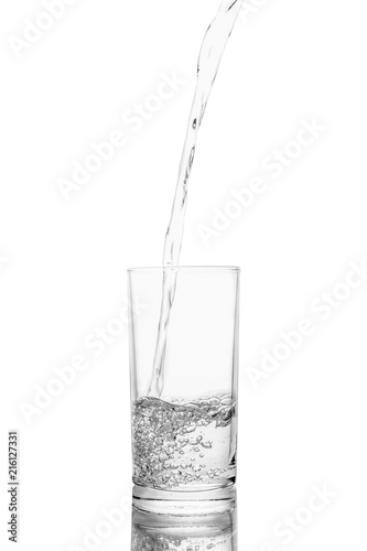 Water poured in glass transparent white background