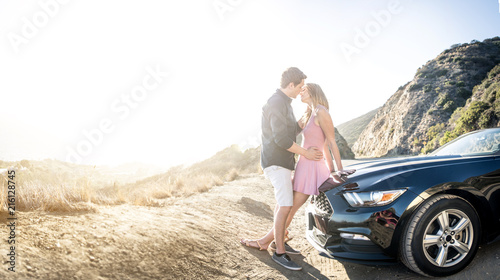 Couple on convertible car