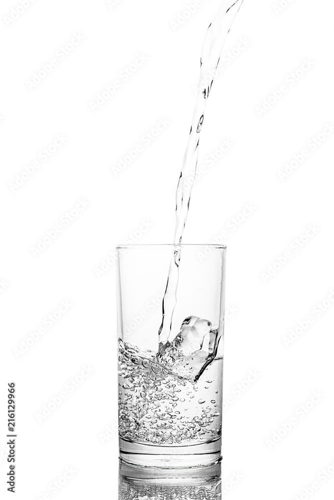 Water poured in glass transparent white background Water poured in glass transparent white background