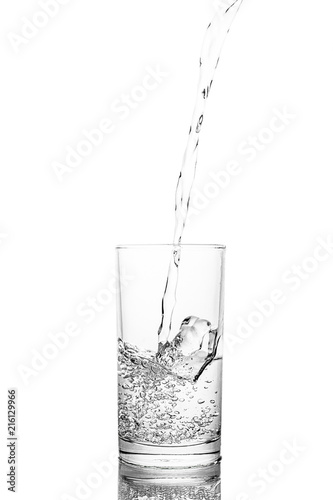 Water poured in glass transparent white background