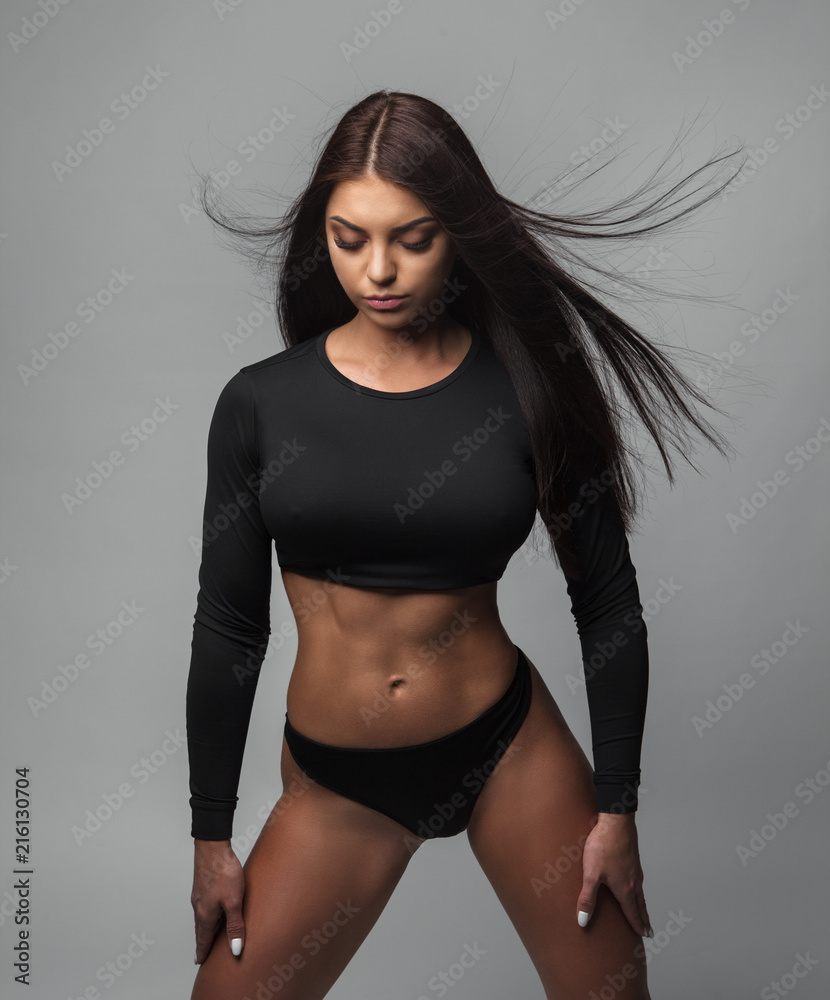 Photo of brunette woman with slim toned body. Beauty and body care concept  Stock Photo
