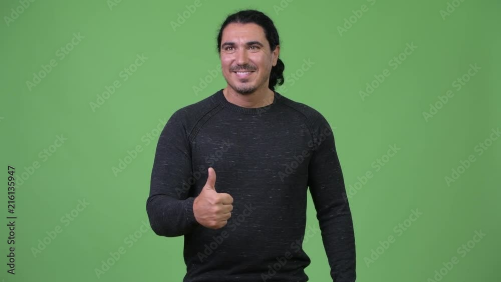 Handsome man giving thumbs up Handsome man giving thumbs up