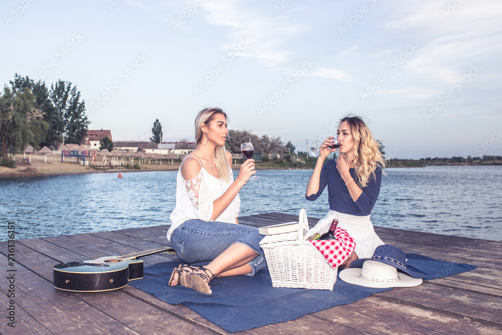 Beautiful  girls enjoying a picnic