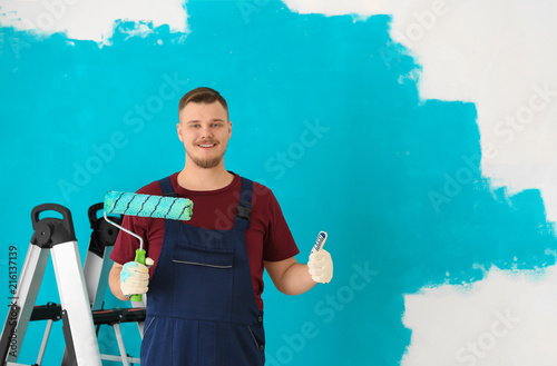 Male painter in uniform wit...