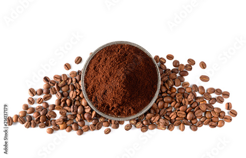 Pile of Ground coffee and coffee beans on white background photo