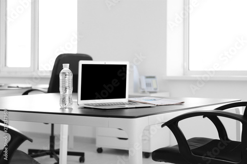 Stylish workplace with lapt...