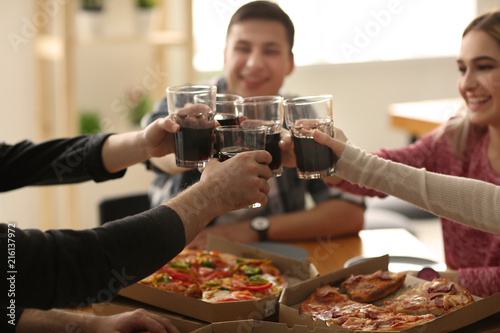 Young people clinking glass...