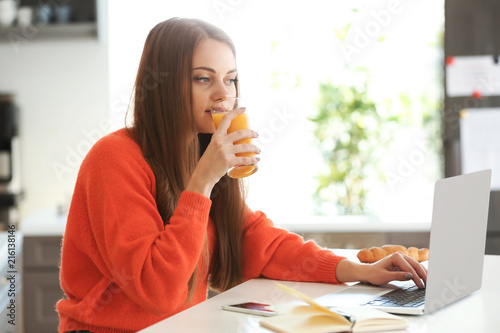 Female freelancer drinking ...