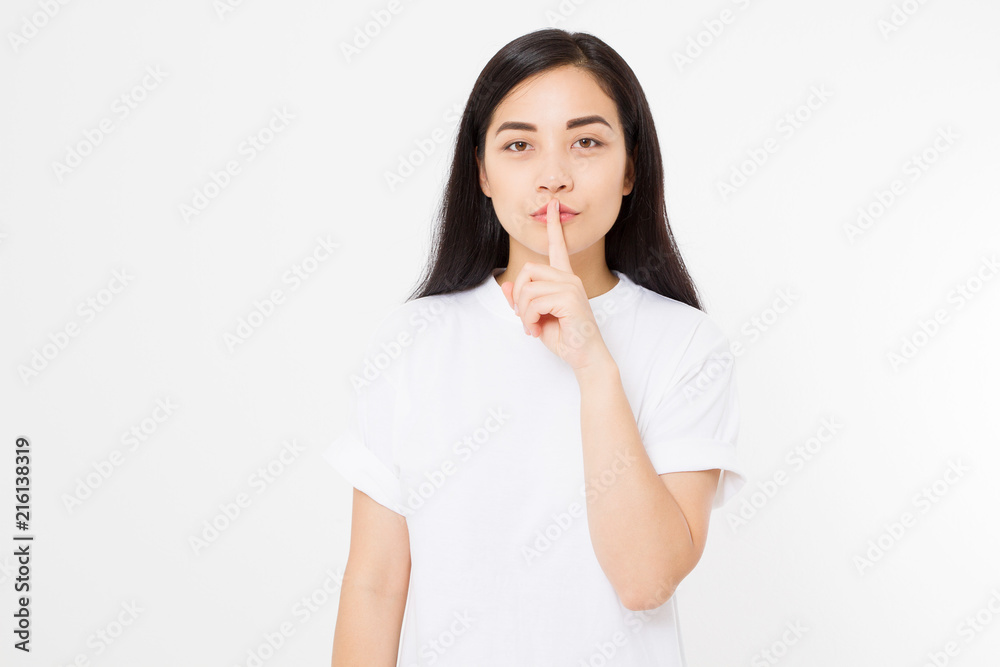 Shh hush sign. Young asian woman isolated on white background in blank summer t shirt. Copy space. Japanese girl Shh hush sign. Young asian woman isolated on white background in blank summer t shirt. Copy space. Japanese girl