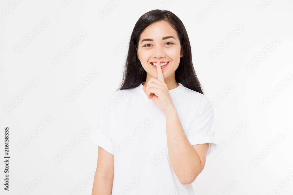 Shh hush sign. Young asian woman isolated on white background in blank summer t shirt. Copy space. Japanese girl Shh hush sign. Young asian woman isolated on white background in blank summer t shirt. Copy space. Japanese girl