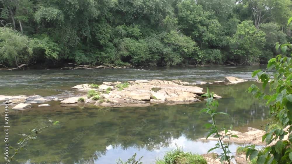 Georgia, Settles Bridge Park, A zoom out from rocks and flowing water on the Chattahoochee River Georgia, Settles Bridge Park, A zoom out from rocks and flowing water on the Chattahoochee River