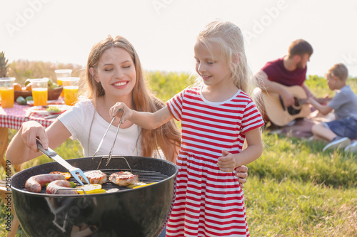 Young woman with daughter c...