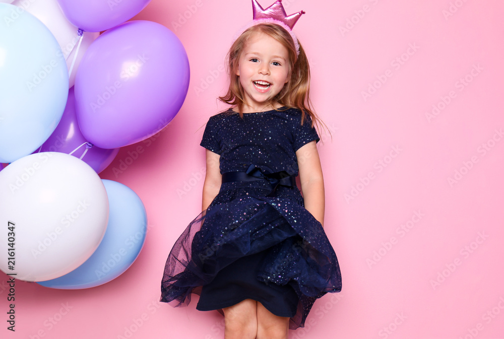 Cute little girl with balloons on color background. Birthday celebration Cute little girl with balloons on color background. Birthday celebration