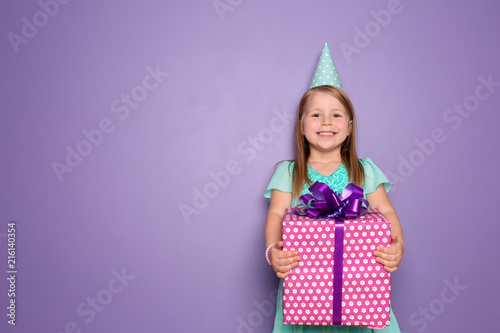 Cute little girl with gift ...
