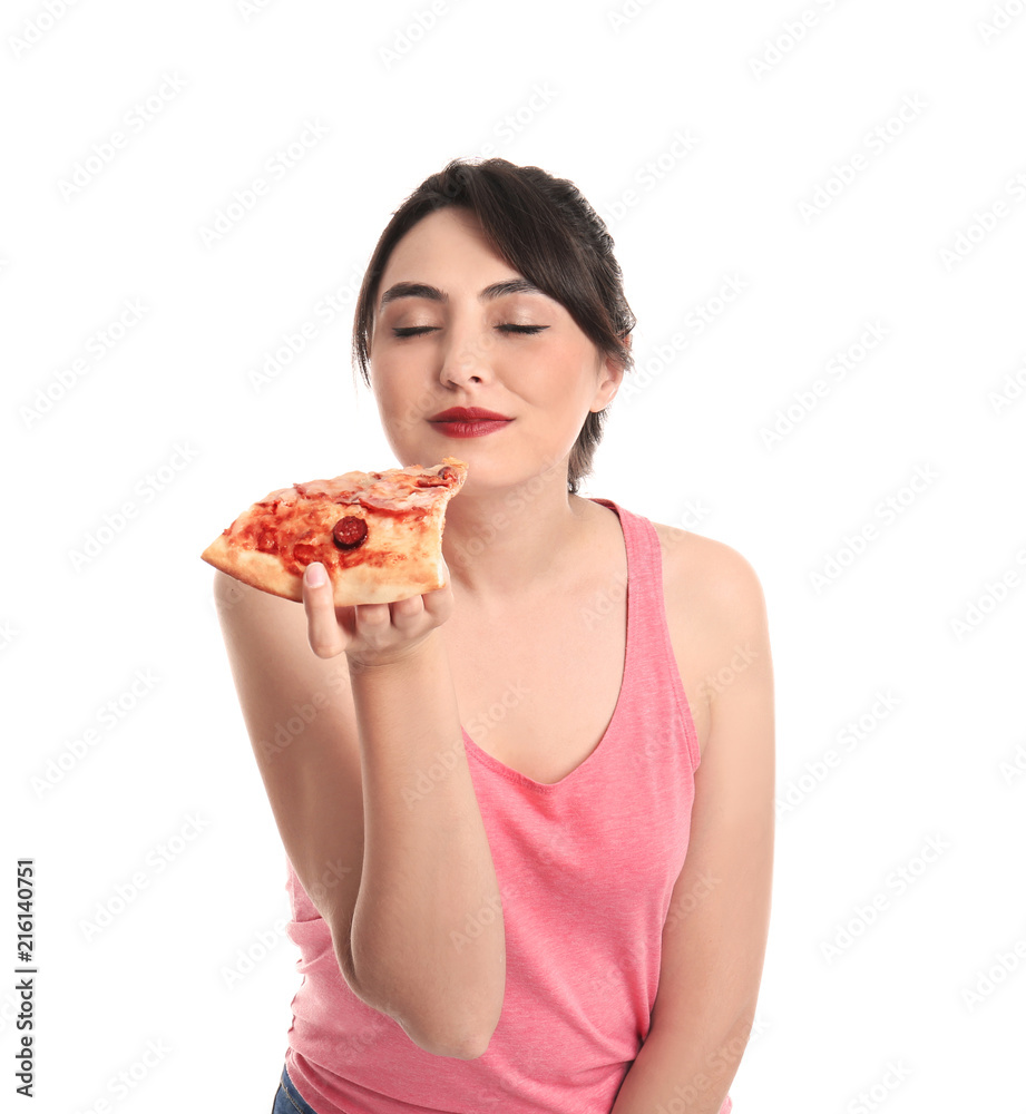 Young woman with slice of hot tasty pizza on white background