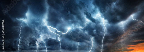 Lightning thunderstorm flash over the night sky. Concept on topic weather, ca...