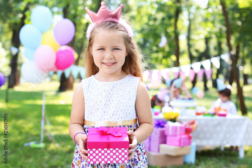 Cute little girl with gift ...