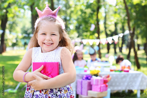 Cute little girl with gift ...