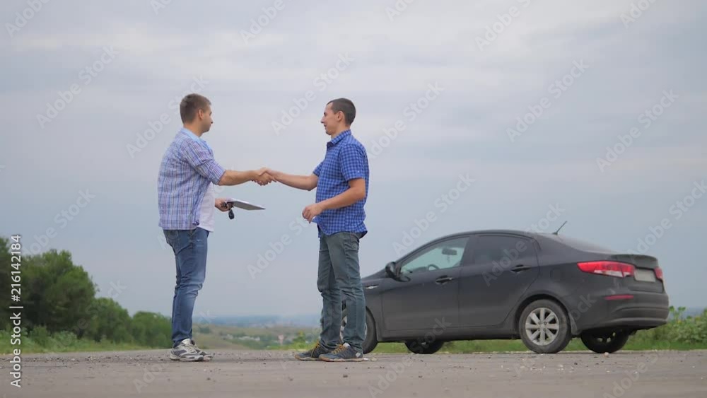 On the road car accident insurance agent examining carcrash owner and insurance staff make paper form. two men make a deal. man seller driver makes car the auto insurance slow motion video sale sells On the road car accident insurance agent examining carcrash owner and insurance staff make paper form. two men make a deal. man seller driver makes car the auto insurance slow motion video sale sells