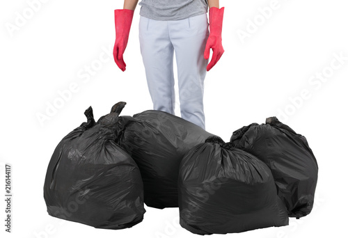 Asian housewife standing with garbage bags, isolated on white background.