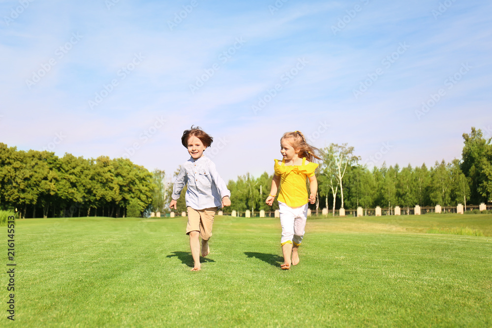 Obraz premium Cute little children running in park on sunny day