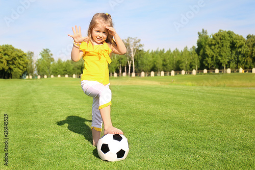 Cute little girl playing fo...