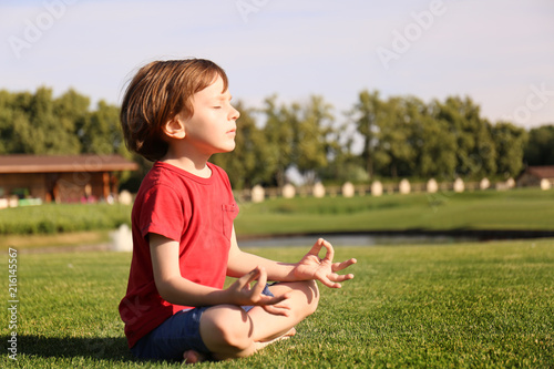Cute little boy practicing ...