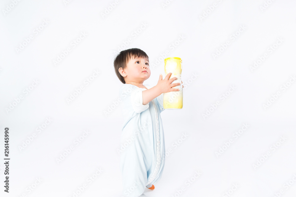 Infant child baby girl kid toddler in diaper make first steps isolated on a white background Infant child baby girl kid toddler in diaper make first steps isolated on a white background