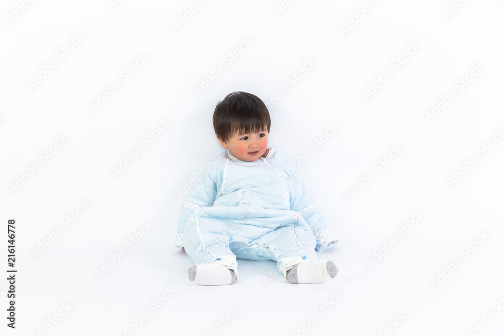 beautiful little baby sits on the floor isolated on white background beautiful little baby sits on the floor isolated on white background