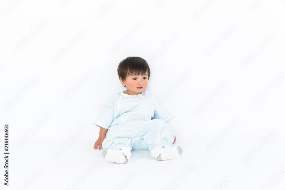 beautiful little baby sits on the floor isolated on white background beautiful little baby sits on the floor isolated on white background